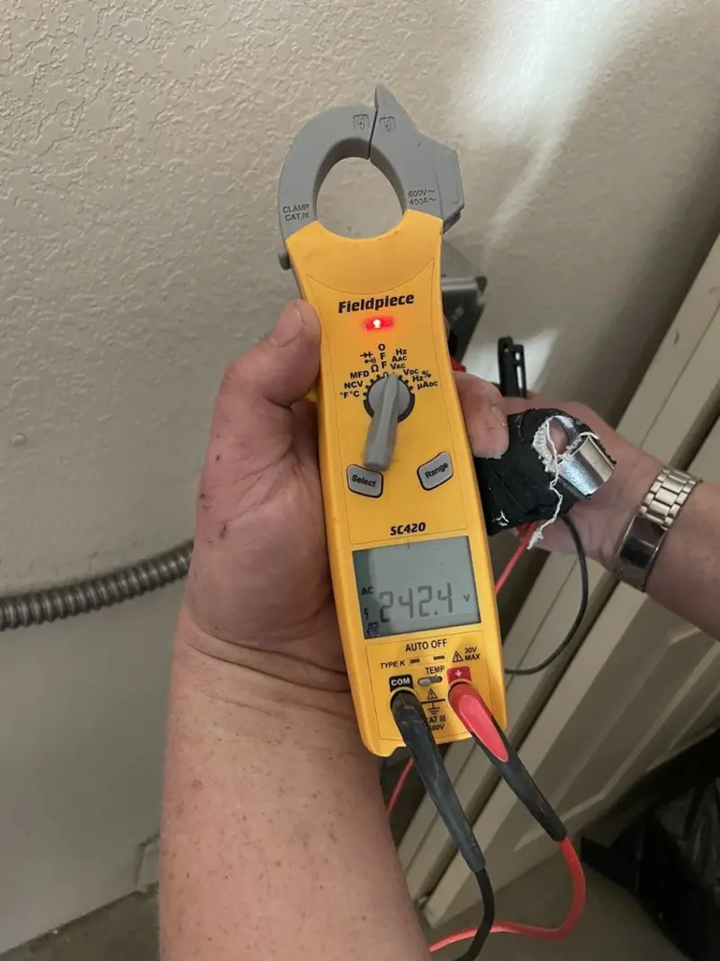 Voltage testing with clamp meter during Whole House Surge Protector in West Hempfield